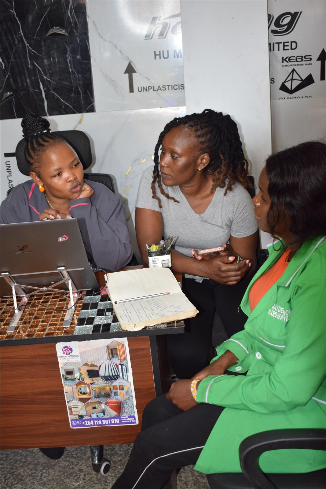 Friendly Interiors team discussing materials and design ideas with a client