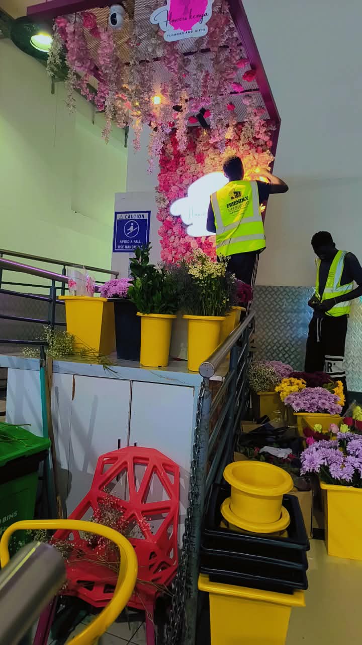 Colourful flower shop installation with hanging floral details