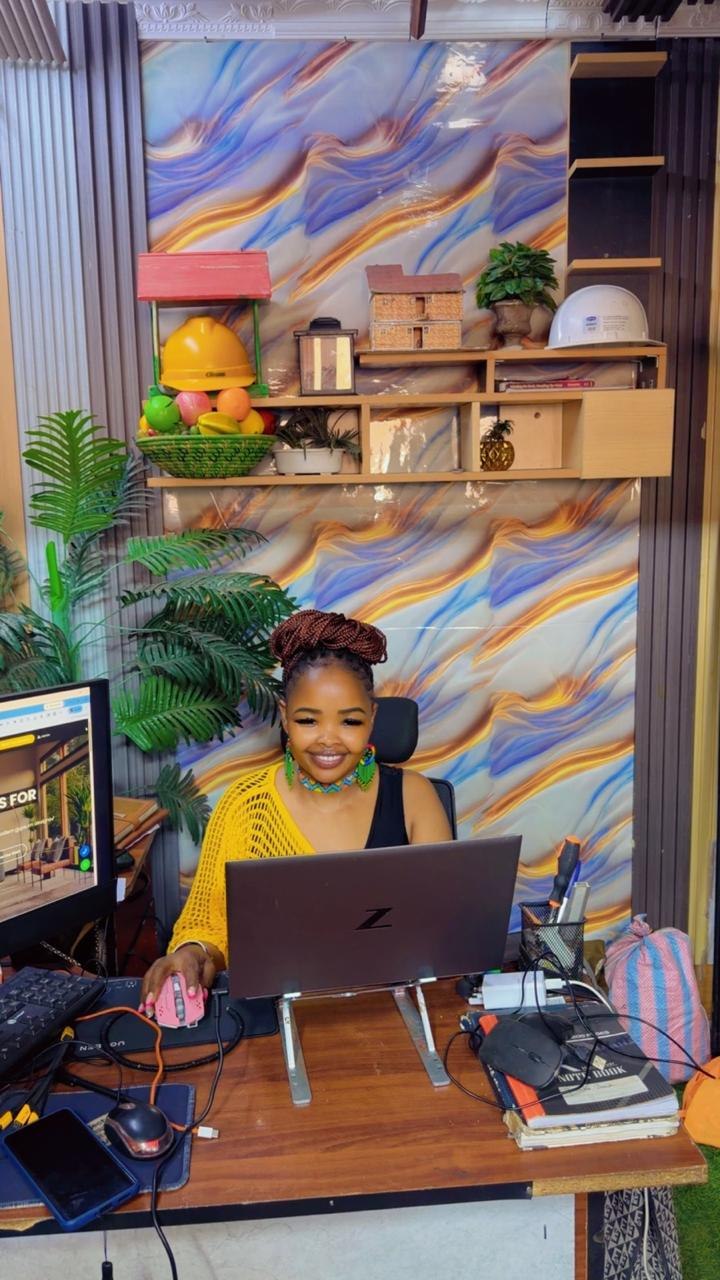 Team member working at a laptop in the Friendly Interiors office