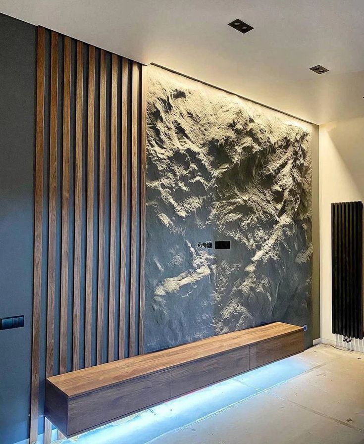 Contemporary residential media wall with timber slats, textured stone and integrated lighting